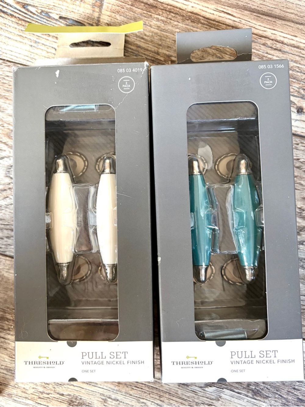 Drawer or Cabinet Pulls New in Box, White and Turquoise Approx 3 inches wide.